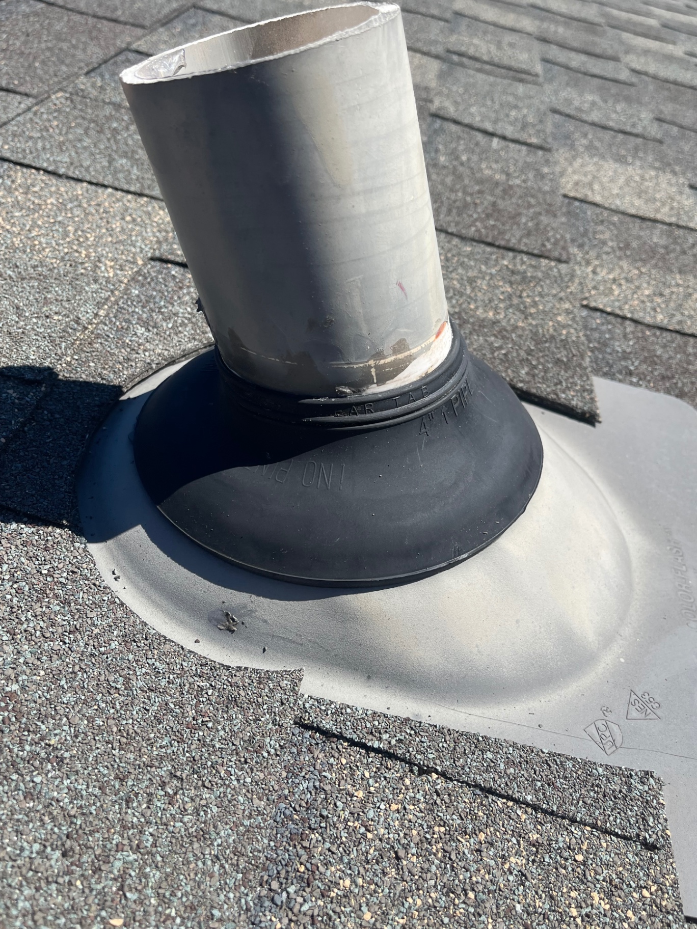 Roof pipe boot flashing after repair with clean new seal