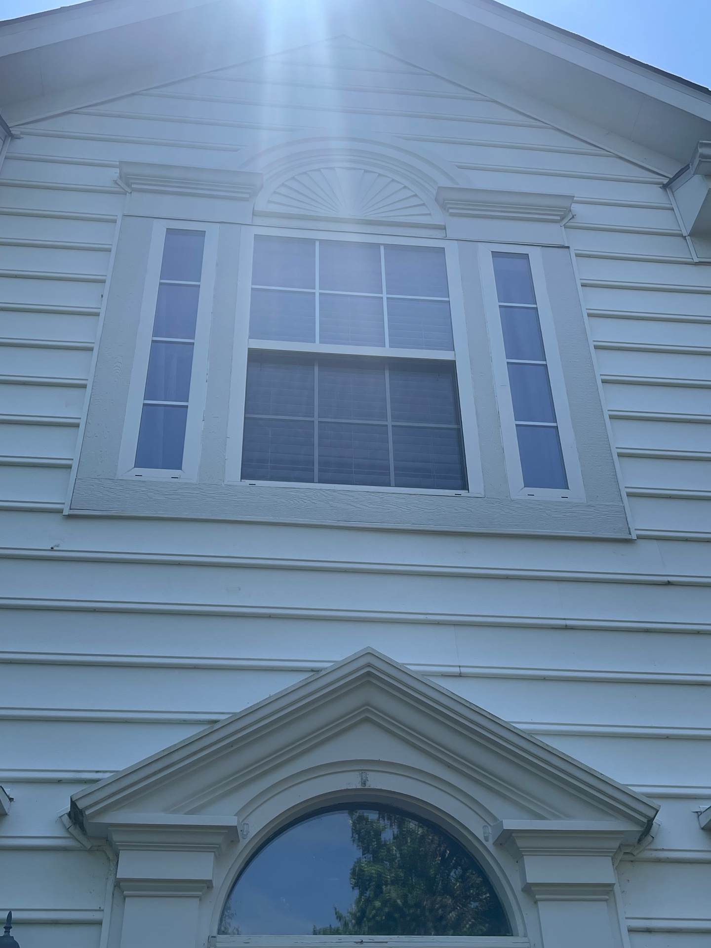 Freshly replaced and painted exterior trim after repair